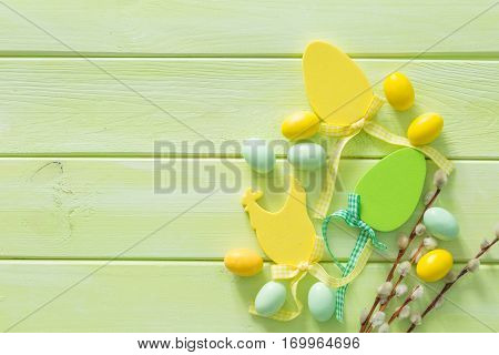 Easter background with flaffy willow and decorations, copy space