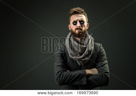 Portrait of elegant pocker player with black chips in eyes