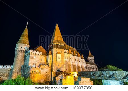 Hunedoara, Romania - May 17, 2015: Tourists visiting Corvin Castle, also known as Hunyadi Castle or Hunedoara Castle which is a Gothic-Renaissance castle in Hunedoara, Romania