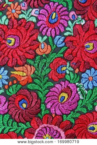 Multicolor floral hand embroidery pattern macro image