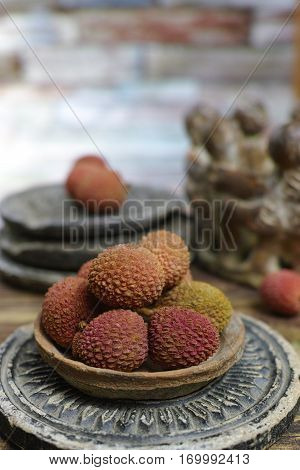 Tropical fruit - Lychees on wooden background