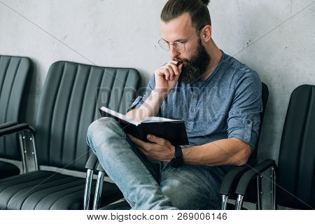 Man Thinking Over His Notes. Contemplation Planning And Brainwork.