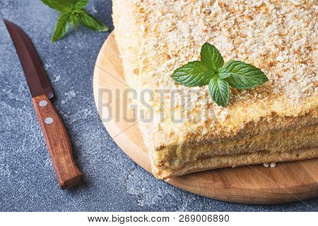 Layered Cake With Cream Napoleon Millefeuille Vanilla Slice With Mint On Dark Background.