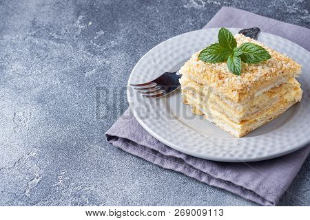 Layered Cake With Cream Napoleon Millefeuille Vanilla Slice With Mint On Dark Background.