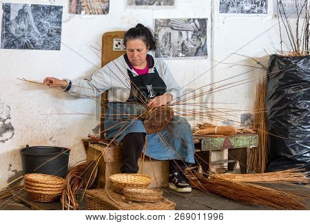 Camacha, Madeira, Portugal - April 19, 2018: A Basket Weaver At Work In The Factory Shop In Camacha 