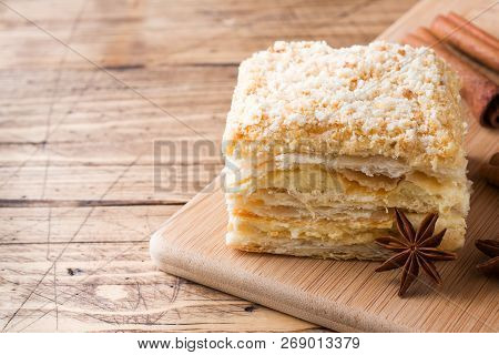 Layered Cake With Cream Napoleon Millefeuille Vanilla Slice With Cinnamon And Anise On Wooden Backgr