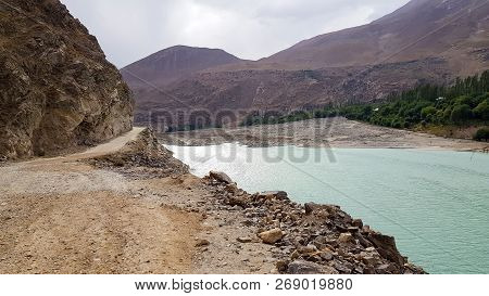 Gravel Balcony Road Along To River Middle Of Mountains.