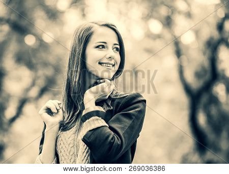 Redhead Girl At Autumn Aoutdoor . Image In Black And White Color Style