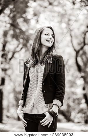 Redhead Girl At Autumn Aoutdoor . Image In Black And White Color Style