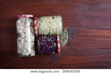 Sauerkraut In A Blue Bowl On A Wooden Table. Top View