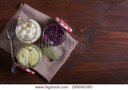 Sauerkraut In A Blue Bowl On A Wooden Table. Top View