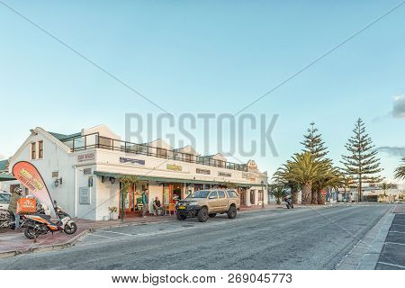 Langebaan, South Africa, August 20, 2018: A Sunset Street Scene, With The Marra Square Centre, Peopl