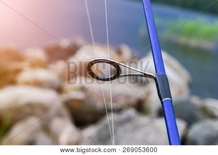 Fishing Rod Spinning Ring With The Line Close-up. Fishing Rod. Fishing Rod Rings Selective Focus And