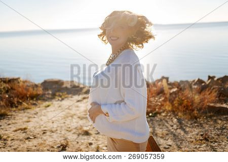 Cheerful Pregnant Woman Spending Sunny Day Outdoor
