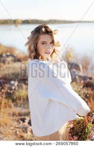 Pregnant Woman Walking In Nature In Good Weather