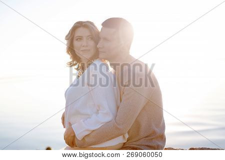 Hugging Young Couple Expecting A First Baby