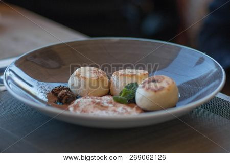 Saint Petersburg,-russia - September 24, 2017 Appetizing Cheese Cakes With Mint Sauce