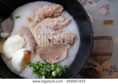 Rice Gruel With Minced Pork, Sliced Pork Liver, Soft Boiled Egg And Chopped Ginger