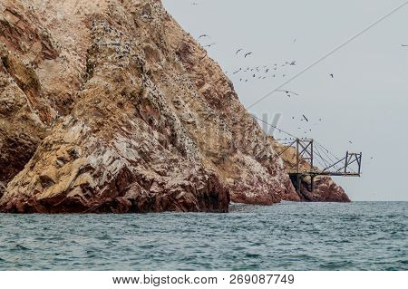 Guano Loading Post On The Rocks Of The Ballestas Islands In The Paracas National Park, Peru.