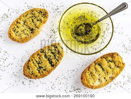 Toasted Bread With Herbs And Olive Oil On Toasted Garlic Bread. Flat Lay. White Background.