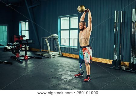 Sportsman With Prosthesis Working Out In Gym