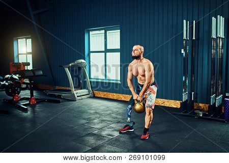Sportsman With Prosthesis Working Out In Gym