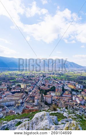 Beautiful Vertical Cityscape From The Peak Of The Mountain In Daylight. Italy