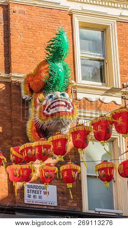 London. November 2018. A View Of A Lion Mask And Colourful Lanterns Hanging In Chinatown In London