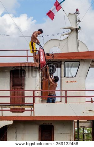 Pantoja, Peru - July 12, 2015: Crew Unloads Cargo Boat Arabela I On River Napo, Peru