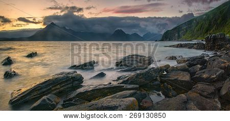 Rocky Coast Of Loch Scavaig With Cuillin Mountains On Sunset, Isle Of Skye, Scotland