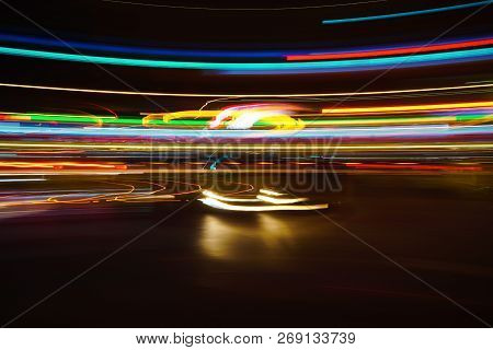 Long Exposured Tail Lights Of Vehicles At Night.