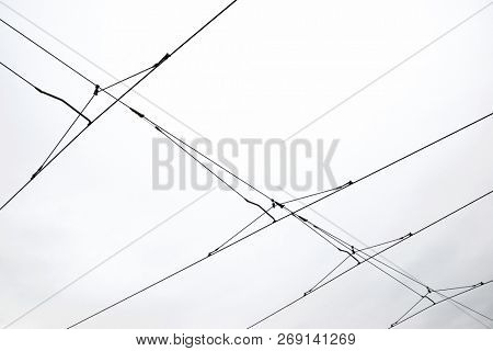 Detail of a catenary and stormy sky.