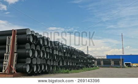 Warehouse Of Finished Plastic Pipes Industrial Outdoors Storage Site. Manufacture Of Plastic Water P