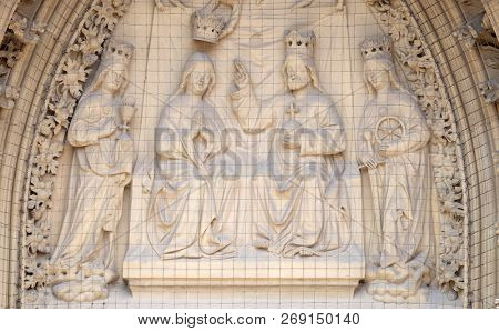 WURZBURG, GERMANY - JULY, O4,2018: The tympanum shows the Coronation of the Virgin portal of the Marienkapelle in Wurzburg, Bavaria, Germany