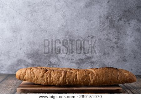 Close Up Of Batard Au Levain On Wood Plate