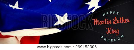 happy Martin Luther King freedom against american flag on empty slate