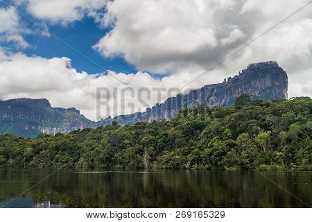 River Carrao And Tepui Table Mountain Auyan In National Park Canaima, Venezuela.