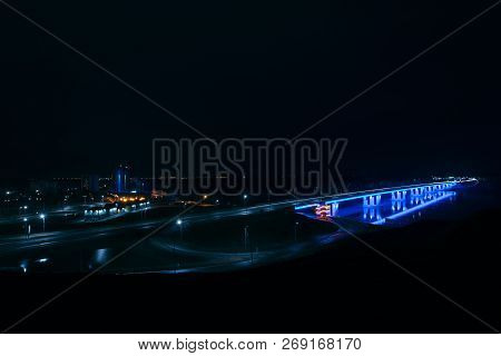 Night Neon Automotive Bridge Over River Ob In Barnaul City, Russia. Blue Illumination Of New Barnaul