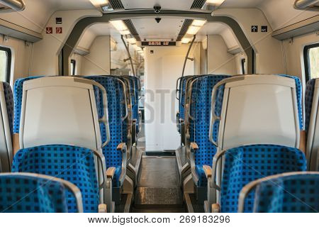 Empty Train Interior In Germany For Moving People For Long And Short Distations. Corridor And A Lot 