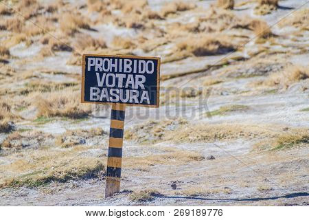 Sign On Altiplano In Bolivia. Do Not Throw A Garbage, Written With An Error.