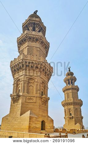 The Ornate Towers Of Medieval Bab Zuwayla Gate, Decorated With Carved Islamic Patterns And Muqarnas 