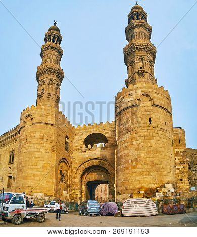 Cairo, Egypt - December 21, 2017: Impressive Historic Bab Zuwayla Gate Boasts Preserved Carved Tower