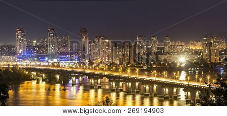 Kyiv (kiev) City, The Capital Of Ukraine At Night Beside The Dnipro (dniepr) River With Reflection I