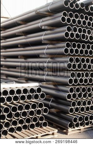 Plastic Pipes In Stock Of Finished Products Stacked In Packs