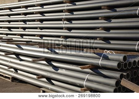 Plastic Pipes In Stock Of Finished Products Stacked In Packs