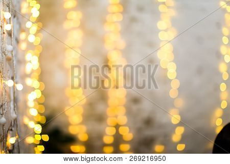 White Brike Wall With Blurred Background With Bokeh Lights, Electric Garland
