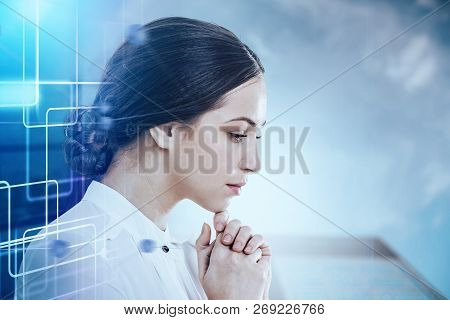 Pensive Young Businesswoman In White Standing Over Blurred City Background With Double Exposure Of D