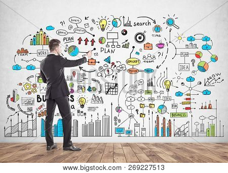 Businessman Drawing Business Plan Sketch