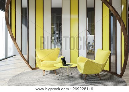 Modern Office Waiting Area With Gray Walls, Wooden Floor, And Yellow Armchairs Standing Near Round C