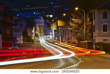 Ight Trails Of Several Cars As They Drive Through Swiss Village 